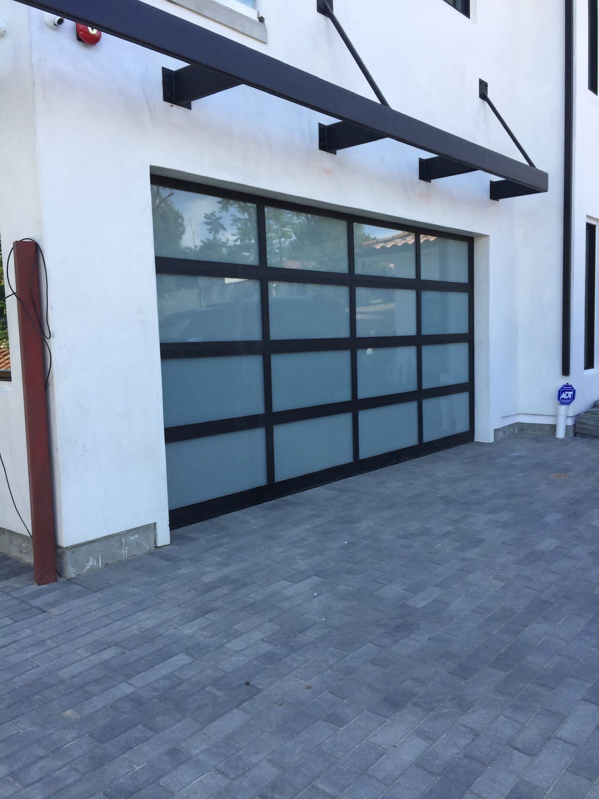 Modern aluminum and frosted glass garage door