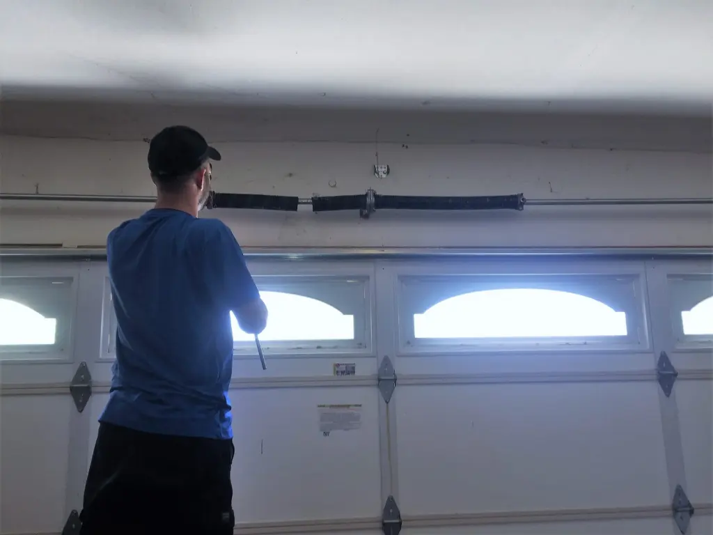 AER technician repairing a garage door in Los Angeles
