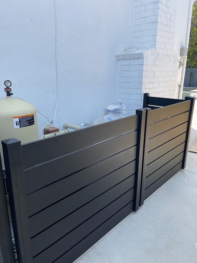 Horizontal aluminum fence around pool equipment