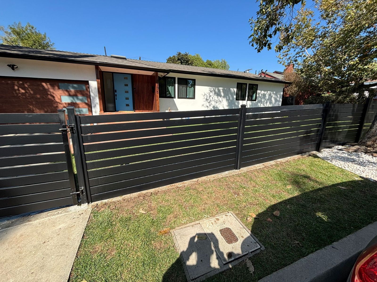 Black horizontal fence and gate
